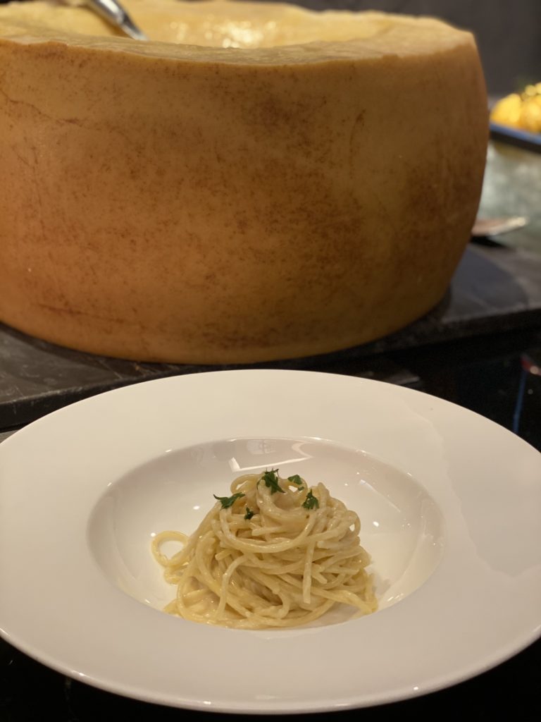 Cheese wheel pasta is made right in front of you adding a splash of Italian to your dining experience.
